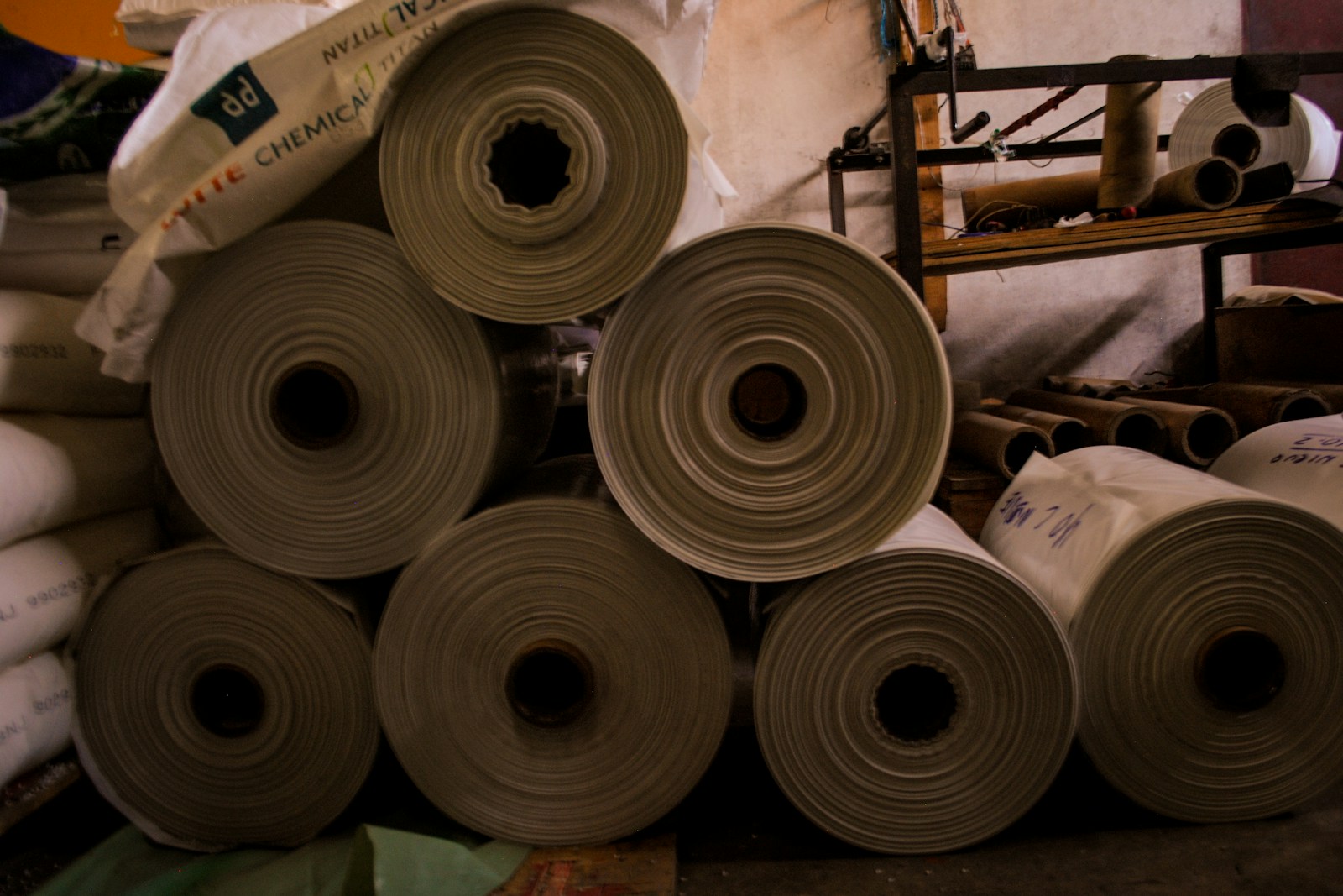 Stacked rolls of paper products in a PSAG production facility
